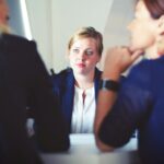 School teachers in a serious discussion over an issue.