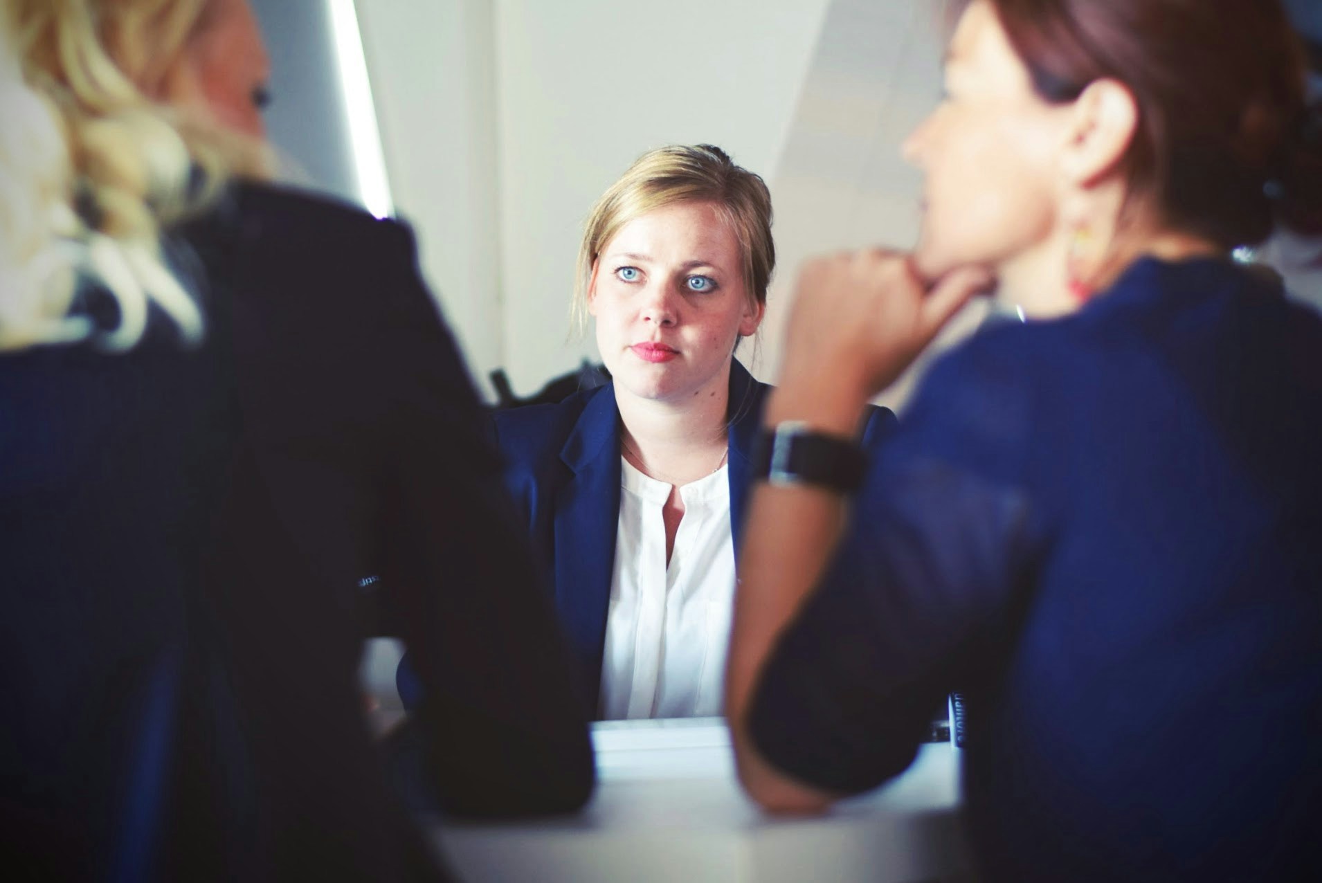 School teachers in a serious discussion over an issue.