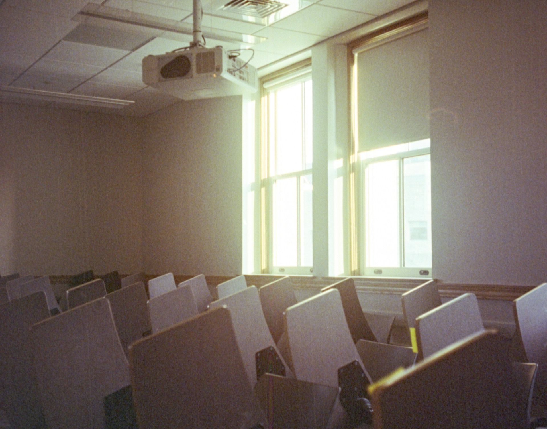Empty chairs in a classroom.