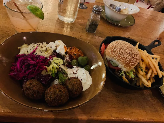 Food served on the table (French fries, meat balls etc.) - Punch Bowl Social, Denver.