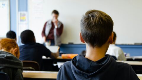 A middle school classroom with teacher and students.