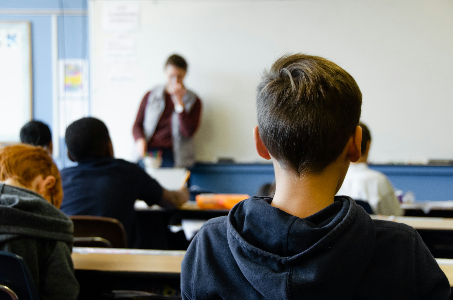 A middle school classroom with teacher and students.